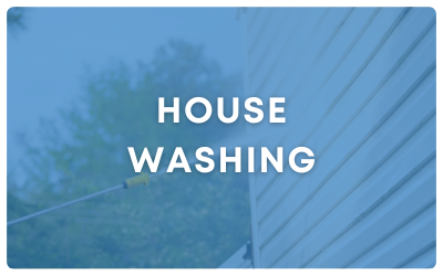 House washing text over a blue-tinted view of siding and trees