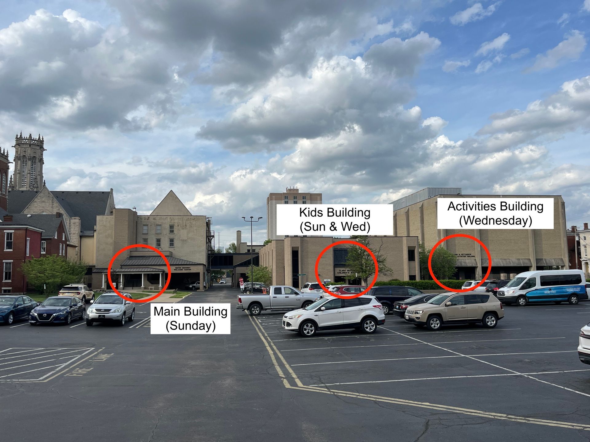 The church buildings, as shown from the parking lot facing north. The left building is labeled