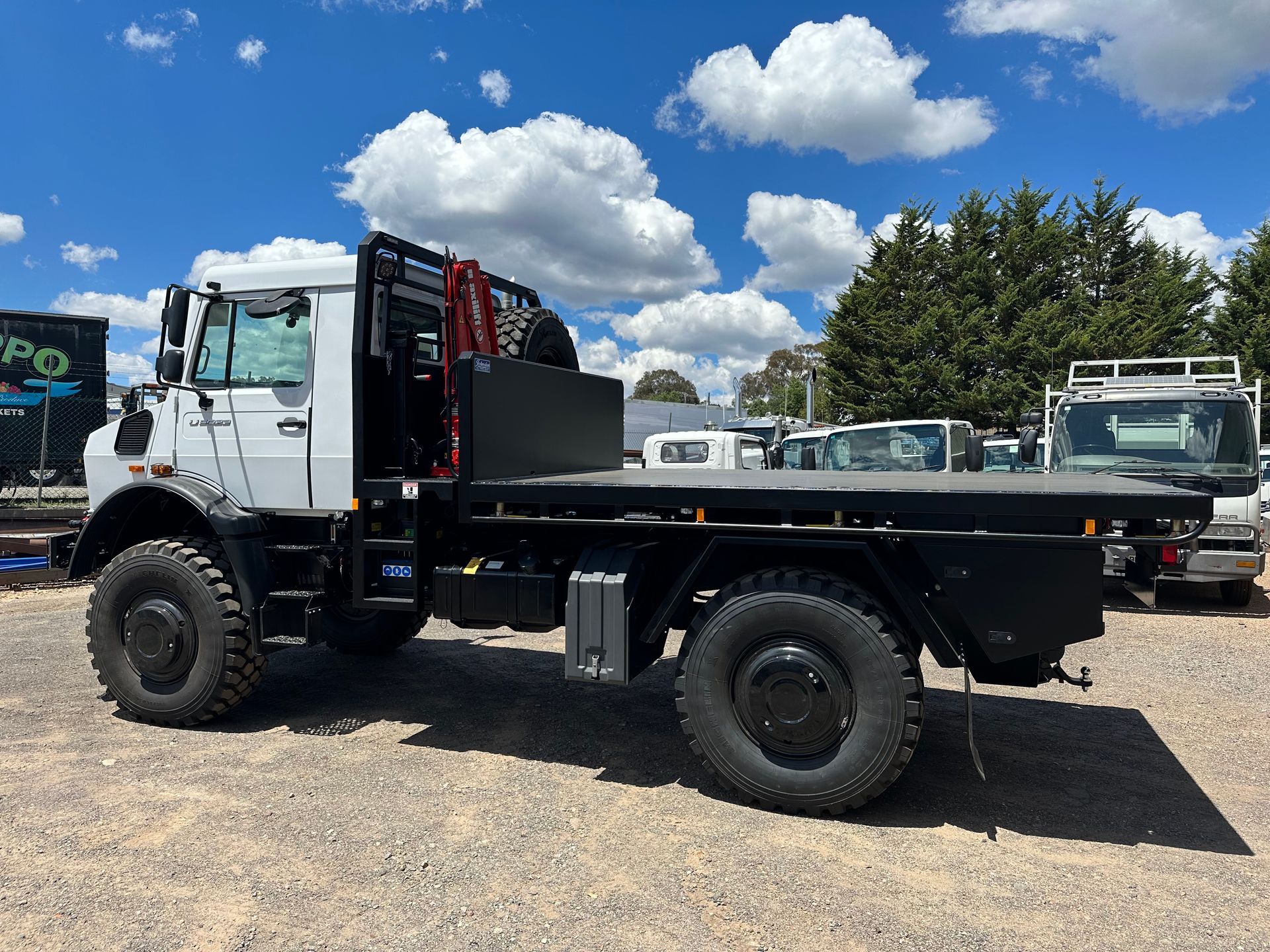 Truck with Huge Tyres — Queanbeyan, NSW — Johnston Truck Bodies Pty Ltd