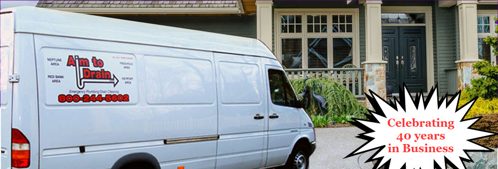 A white van is parked in front of a house that is celebrating 40 years in business