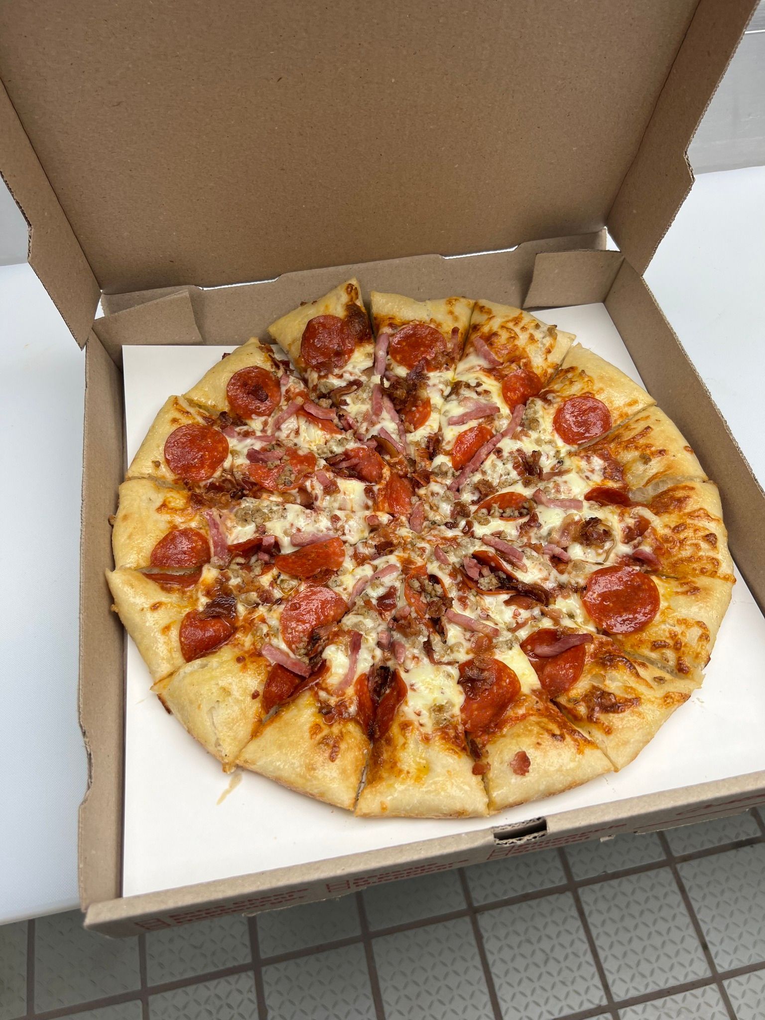 Box of delicious pizza from Lara's Market.