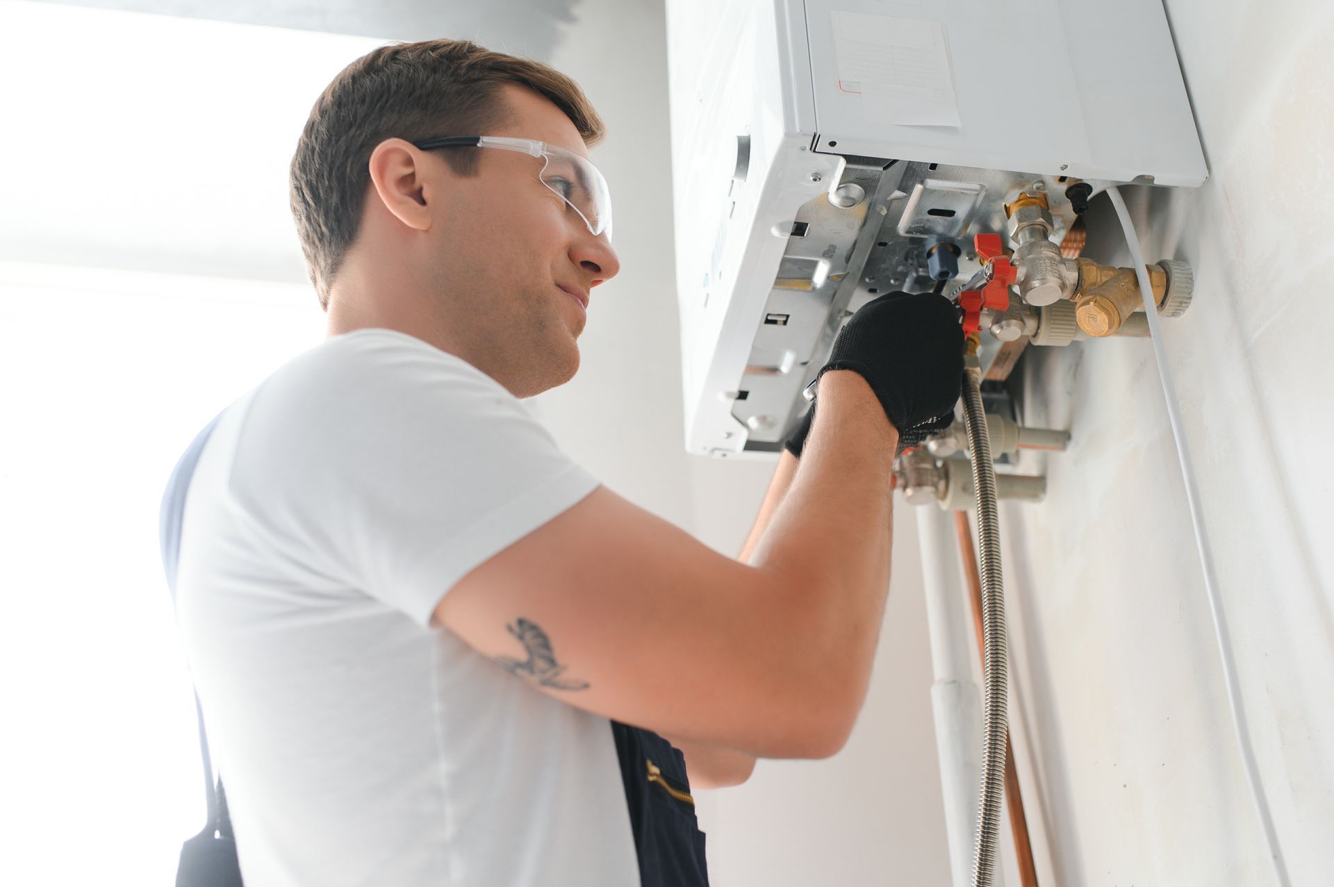 Technician checking a natural gas boiler. Technician checking a natural gas boiler.