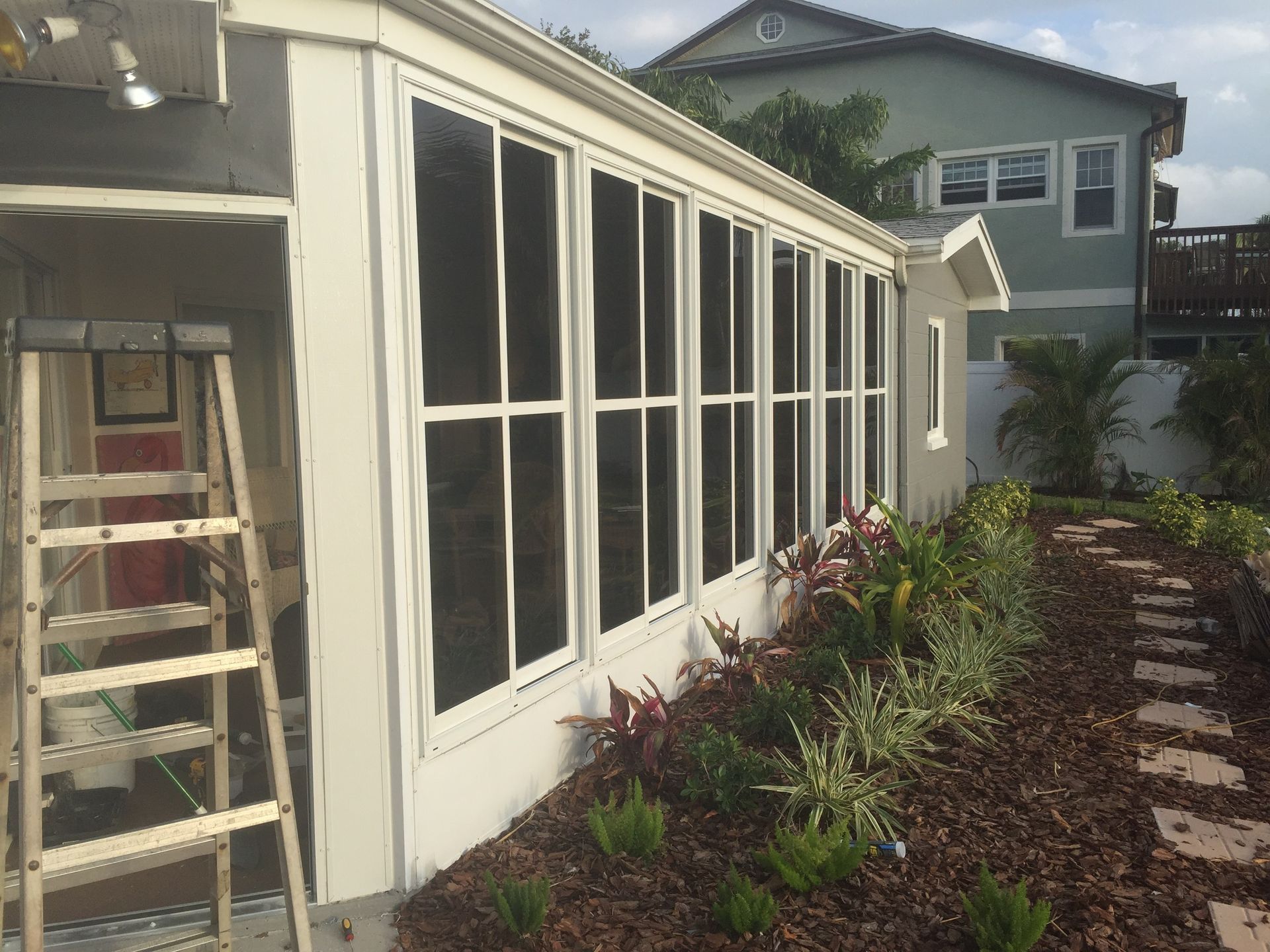 Pool enclosure with ripped screens needing professional repair
