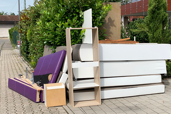 bed and furniture on curb, furniture removal
