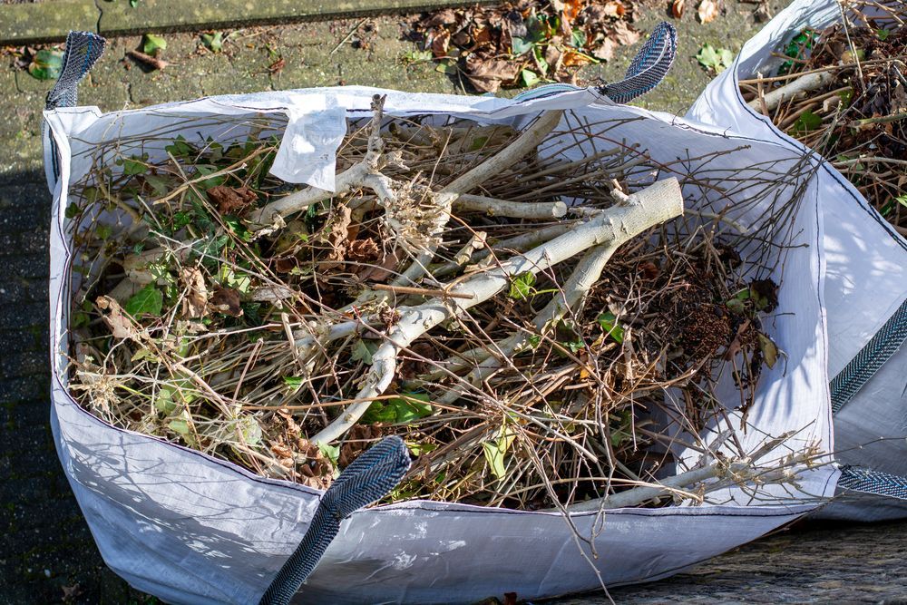 Large White Bag Filled With Yard Waste — All Suburbs Garden Bags in Kuranda, QLD