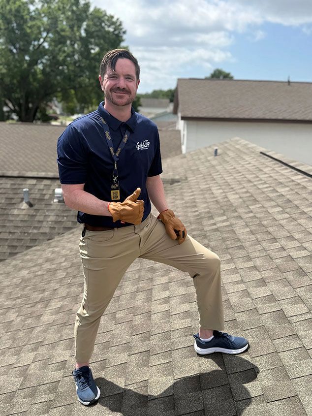 Gold Top Roofing team member inspecting a residential shingle roof in the Tampa Bay area