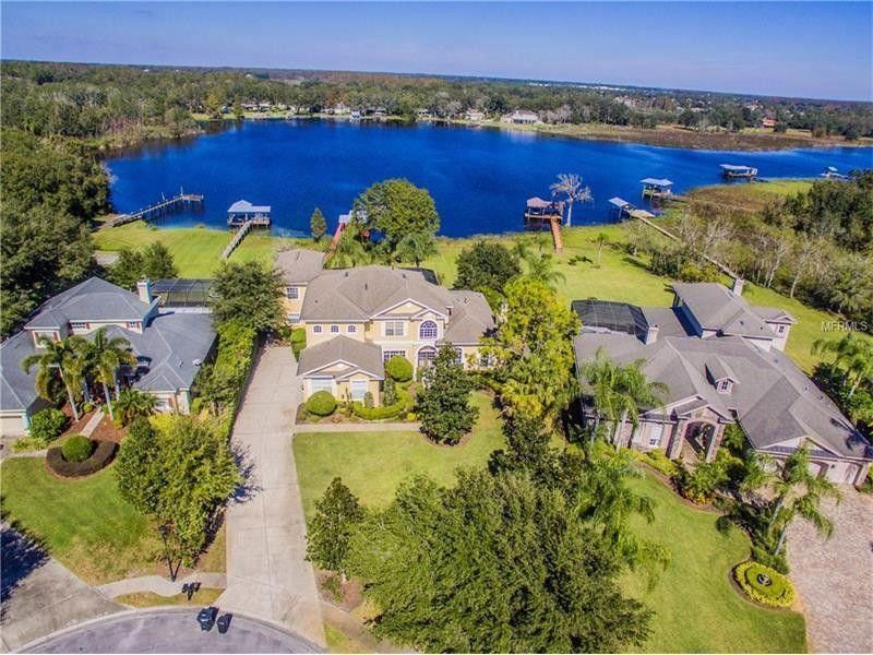 Odessa Florida lakeside neighborhood with residential homes and roofing systems
