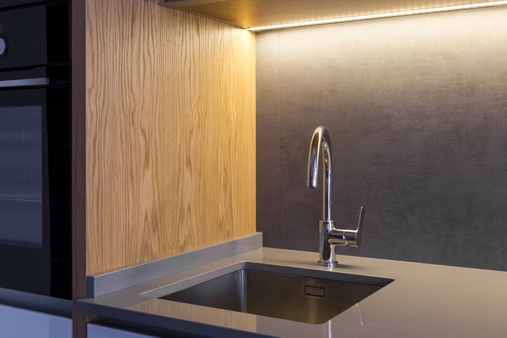 Stainless Steel Kitchen Sink and Faucet With Wooden and Grey Backsplash — Verastone In Fyshwick, ACT