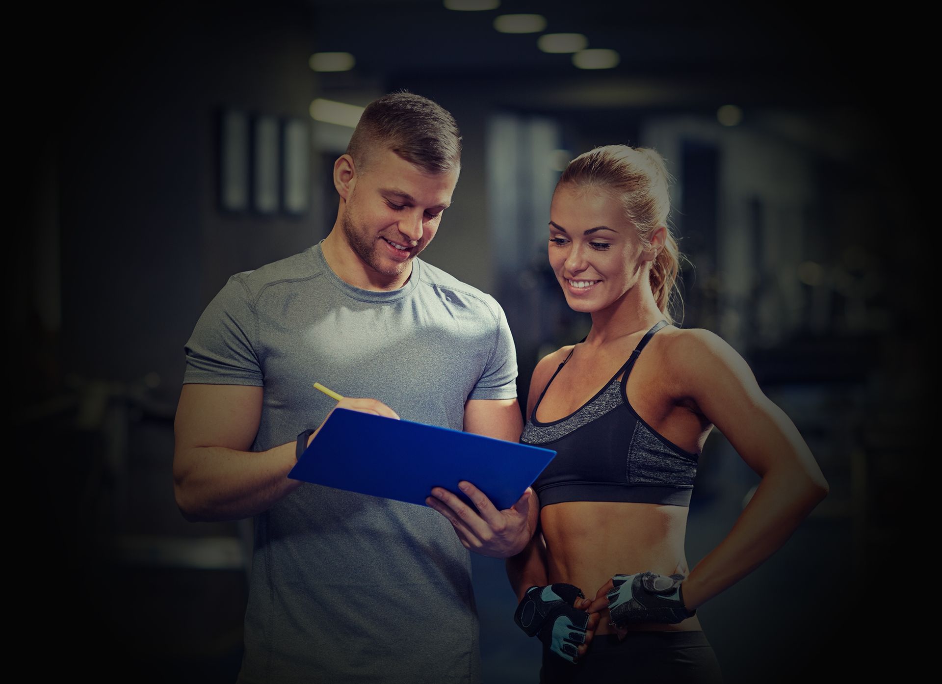 Gym Instructor With His Client