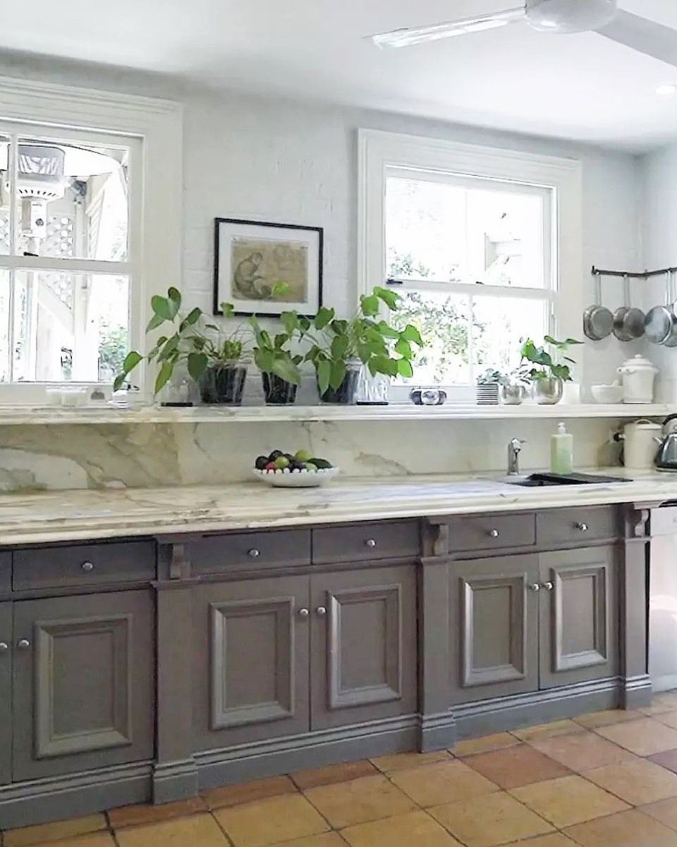 Bright Kitchen With Cabinets, Marble Counters, Potted Plants On The Windowsill, And Floor — Shona Design In Mittagong, NSW
