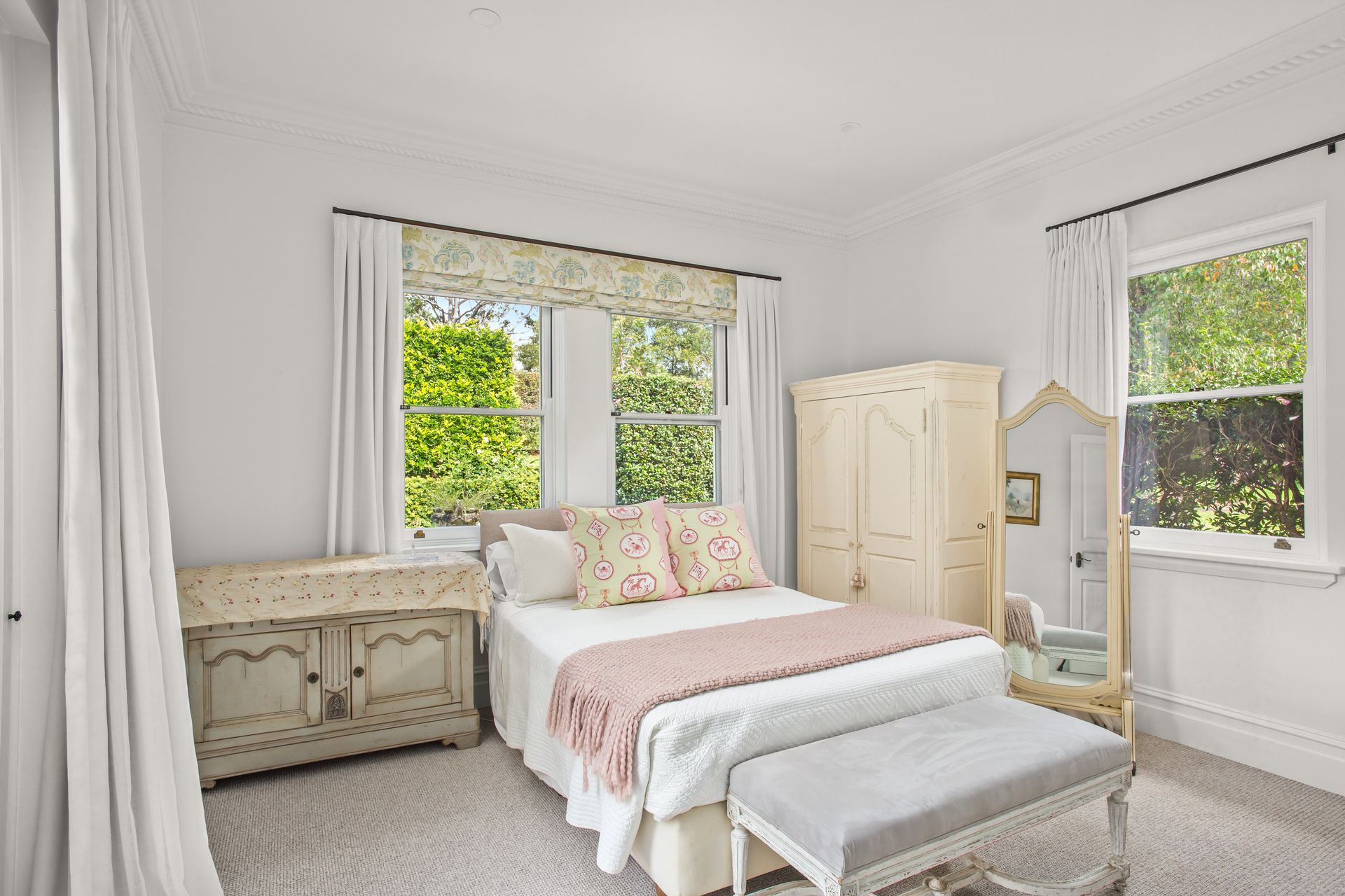 Bright White Bedroom With Floral Bedspread, Vintage Dresser, Armoire, And Large Windows — Shona Design In Mittagong, NSW