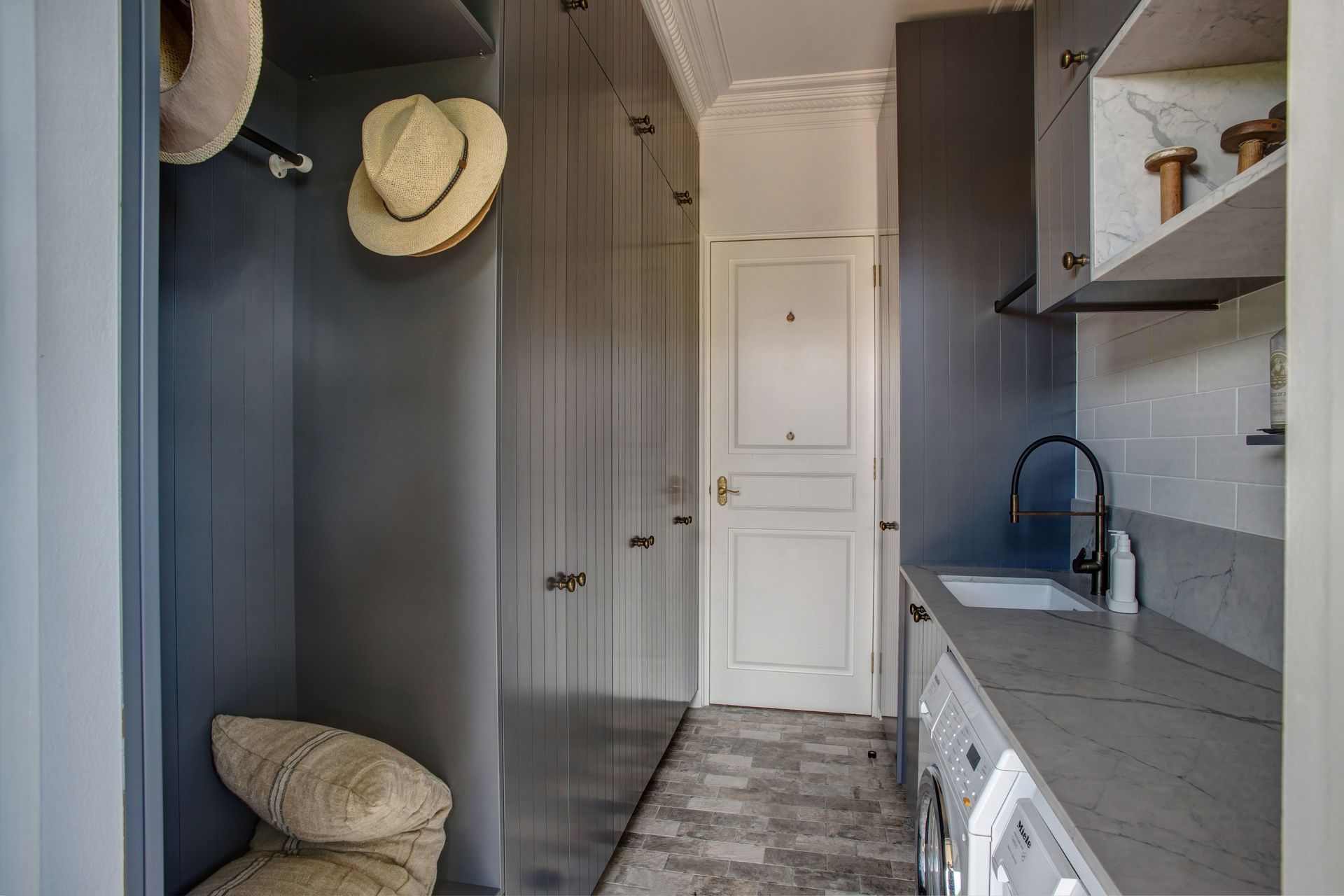 Narrow Laundry Room, White Cabinets, And A Floor, Featuring A Hanging Hat And Woven Basket — Shona Design In Mittagong, NSW