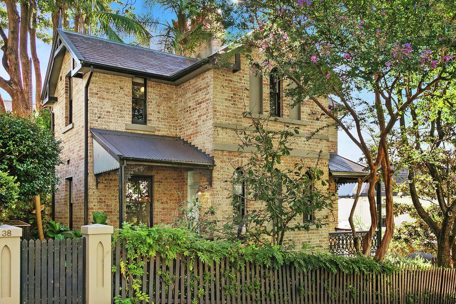 Two-story Tan Brick House With a Black Roof — Shona O'Brien Interior Design in Bowral, NSW