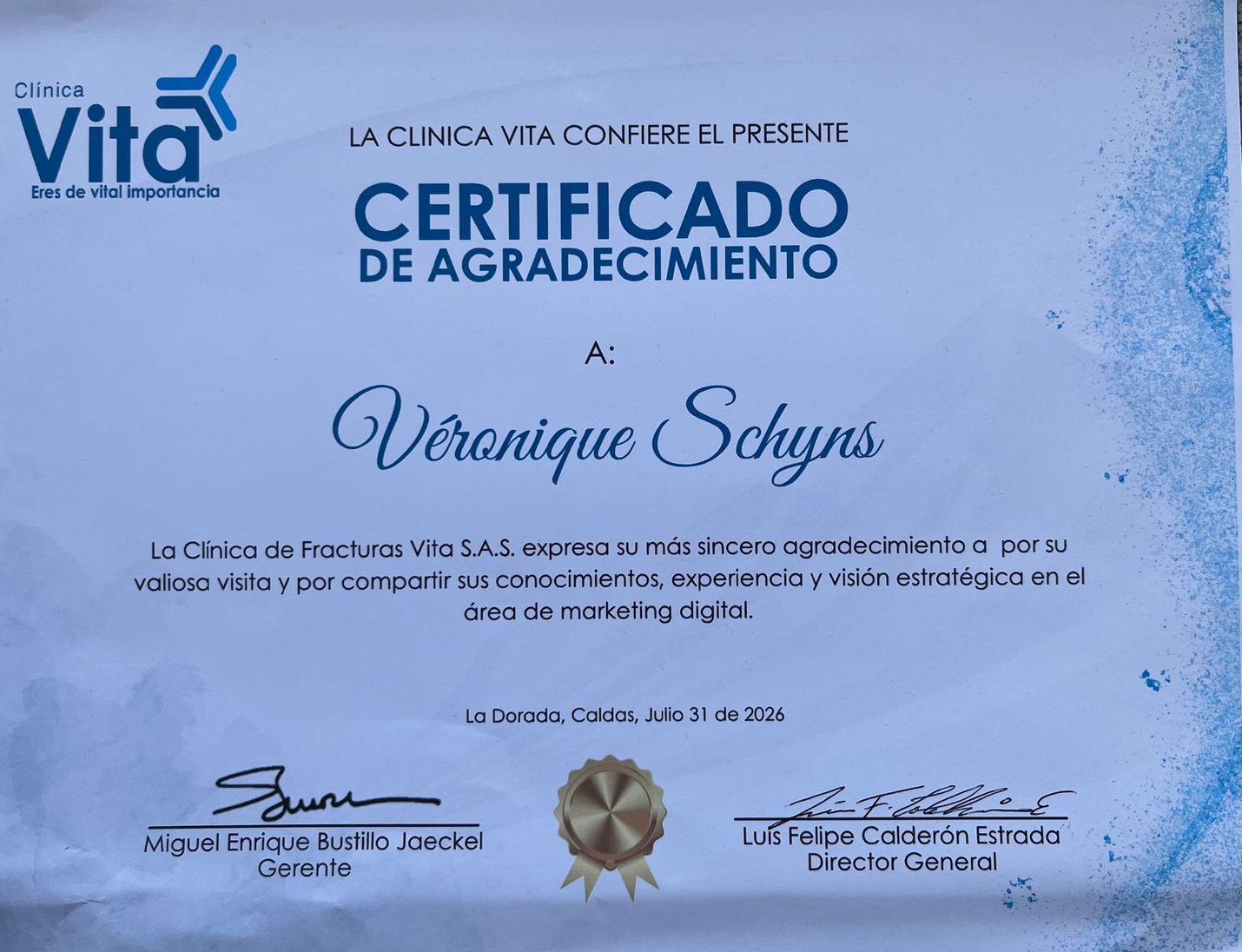 Blue “Certificado de Agradecimiento” award certificate with decorative script and seals