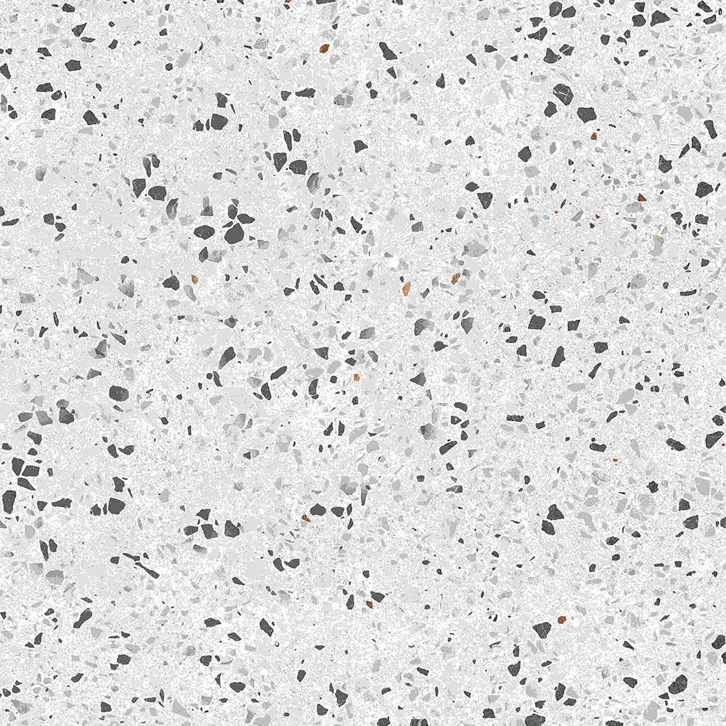A close up of a white terrazzo floor with black spots.