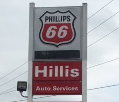 Phillips 66 gas station sign with fuel prices: Regular $2.31, Premium $2.81, Diesel $2.42. Hillis Auto Services and Sales.