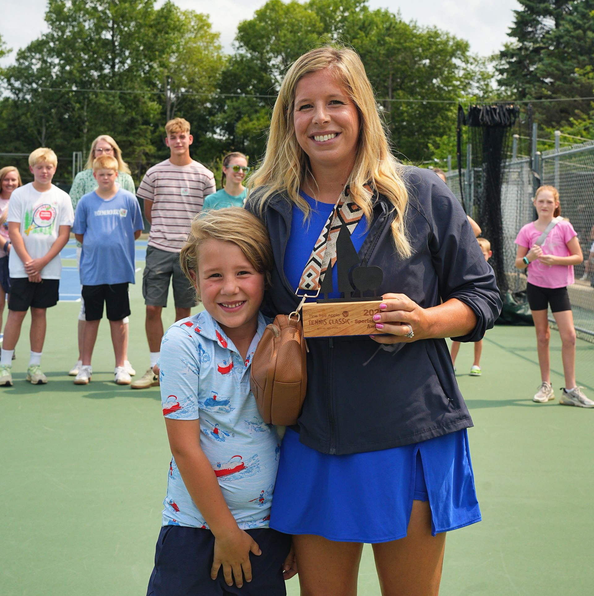 Callee Anderson holds sportsmanship trophy