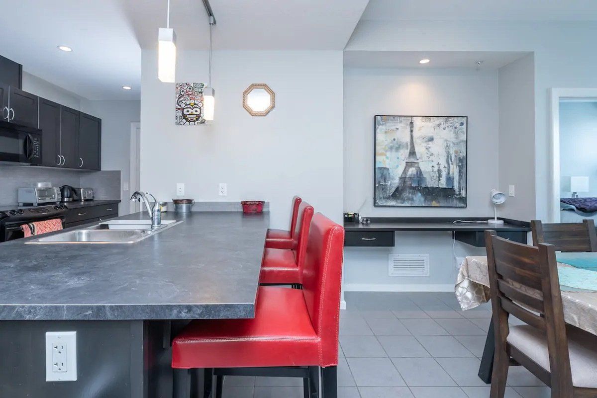 Nuera furnished suite kitchen and living area