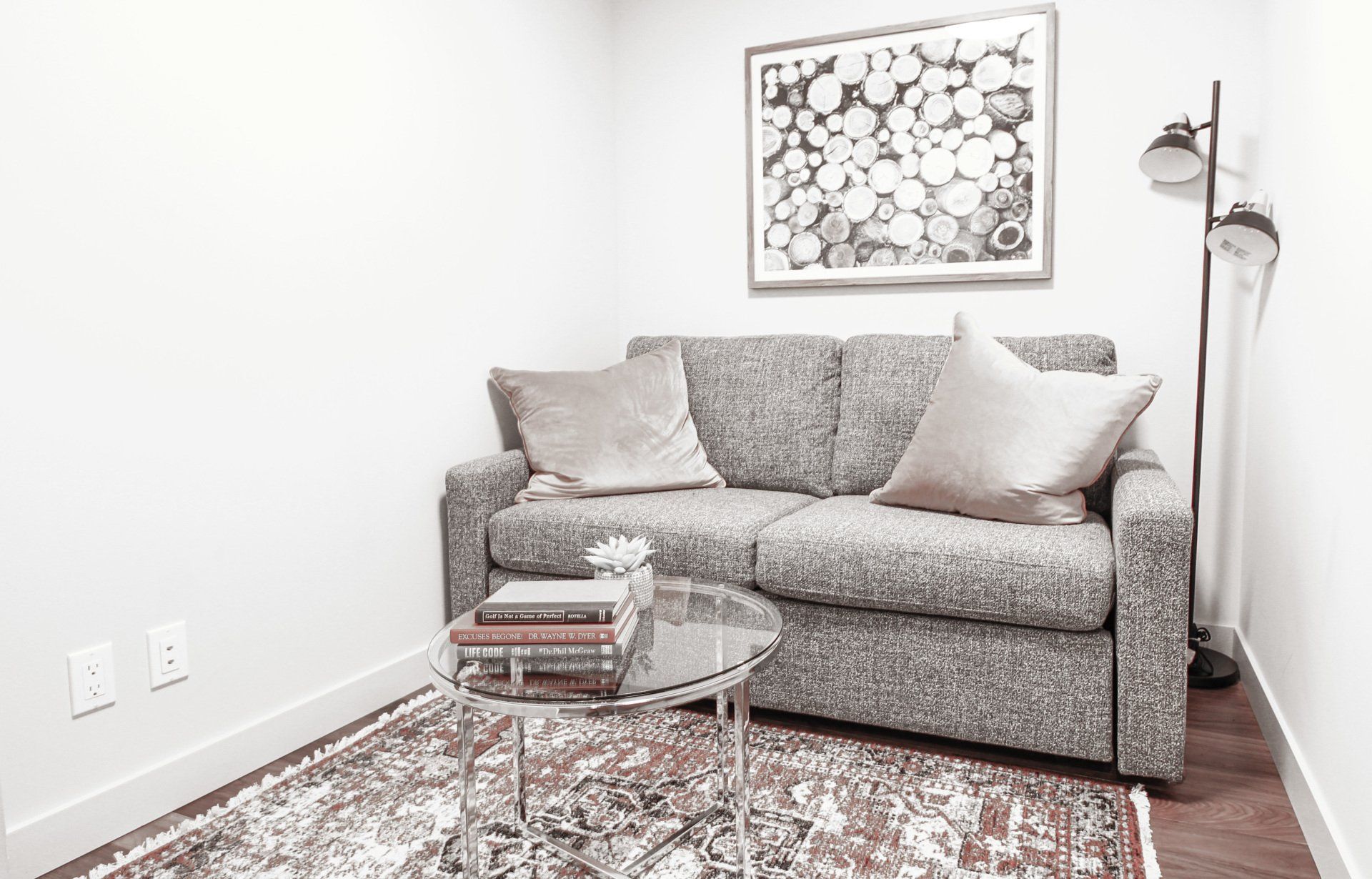 Den grey cloth fold away couch in this one bedroom plus den furnished suite in downtown edmonton