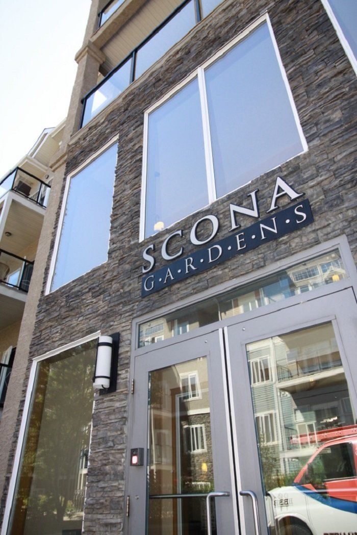 Front door of the building with the name above the door Scona Gardens