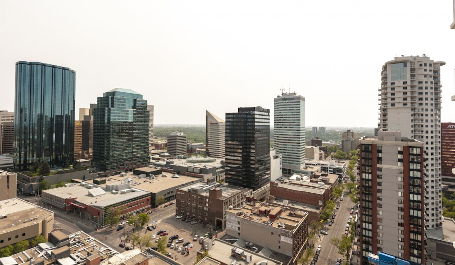 Downtown cityscape with skyscrapers, buildings, and clear sky.