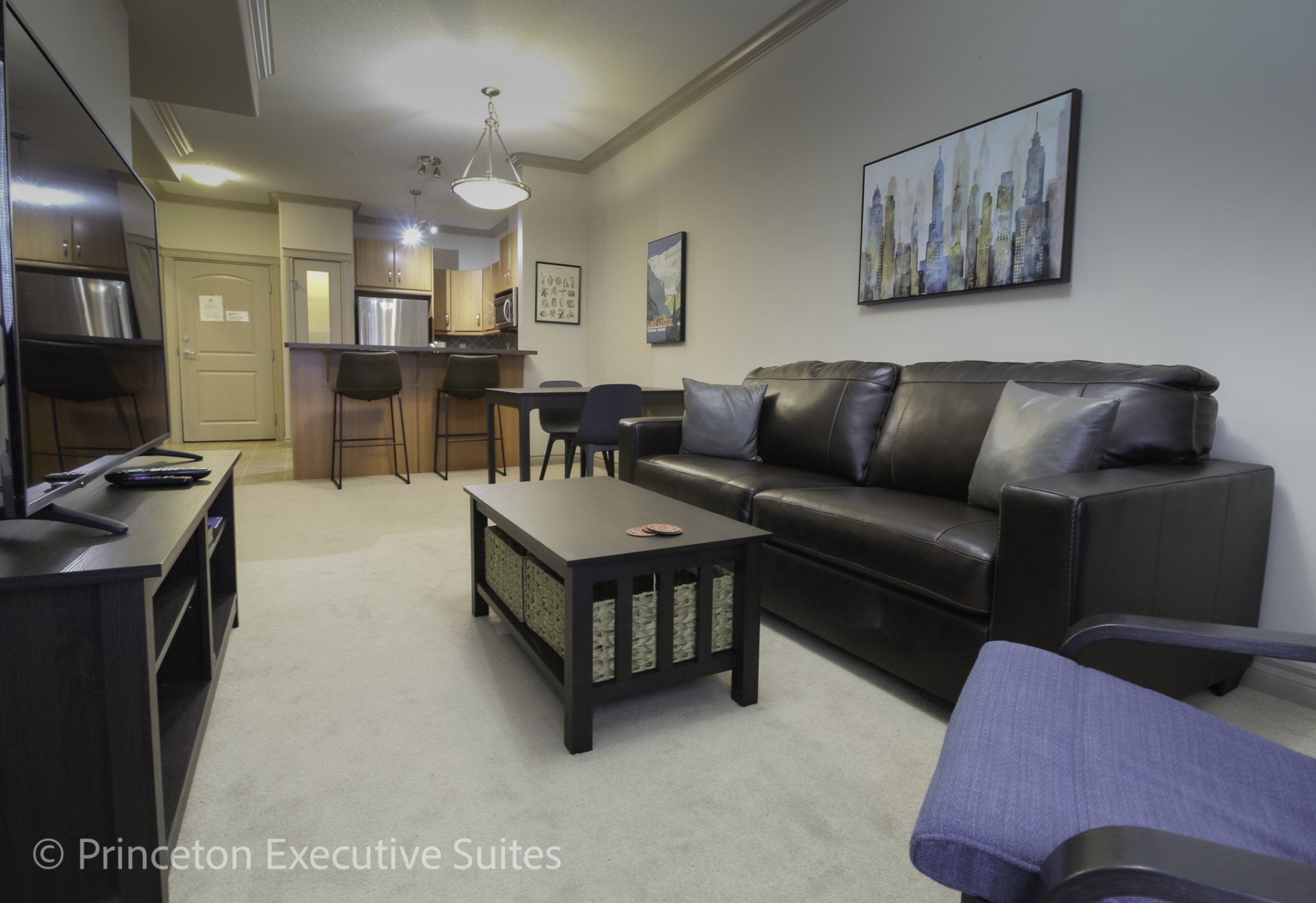 Living room, been capuchin and dining area of Edmonton furnished apartment