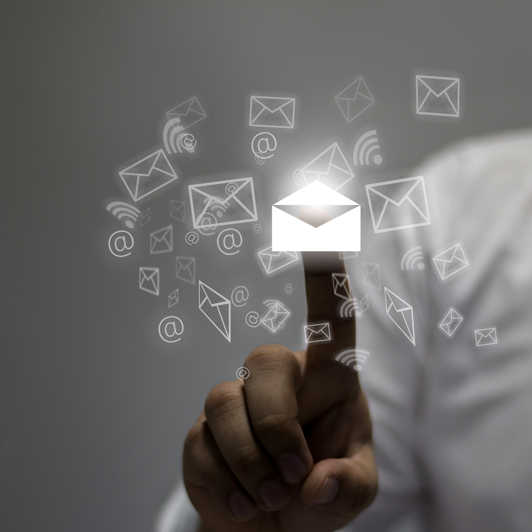 A person is pressing a button with an envelope coming out of it