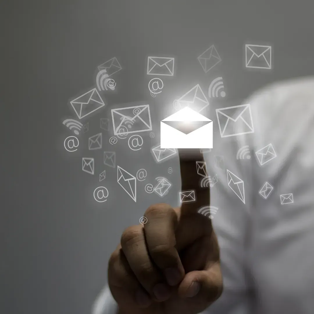 A person is pressing a button with an envelope coming out of it