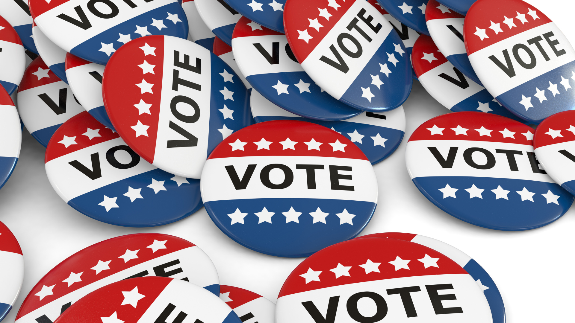 A pile of red white and blue vote buttons