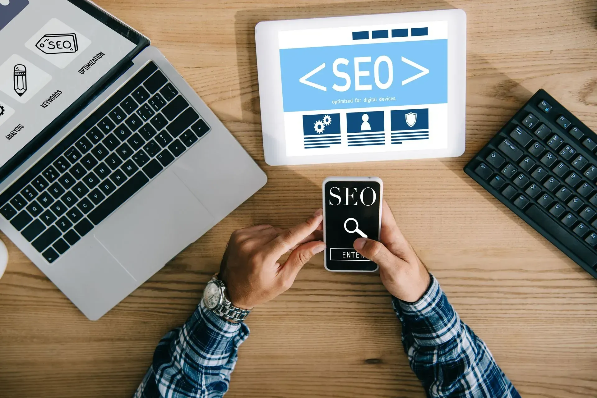 A person is holding a cell phone with the word seo on it