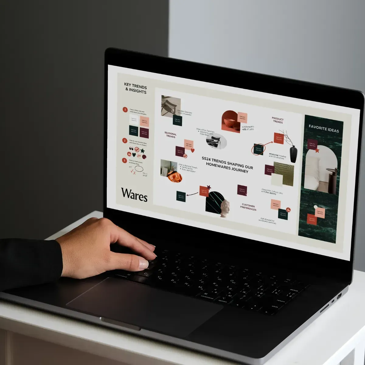 A person is typing on a laptop that says waves on the screen