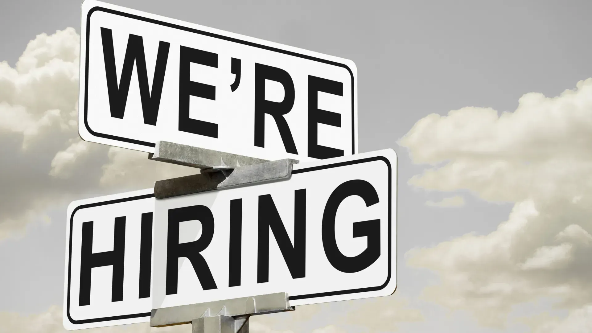 A sign that says we 're hiring on it