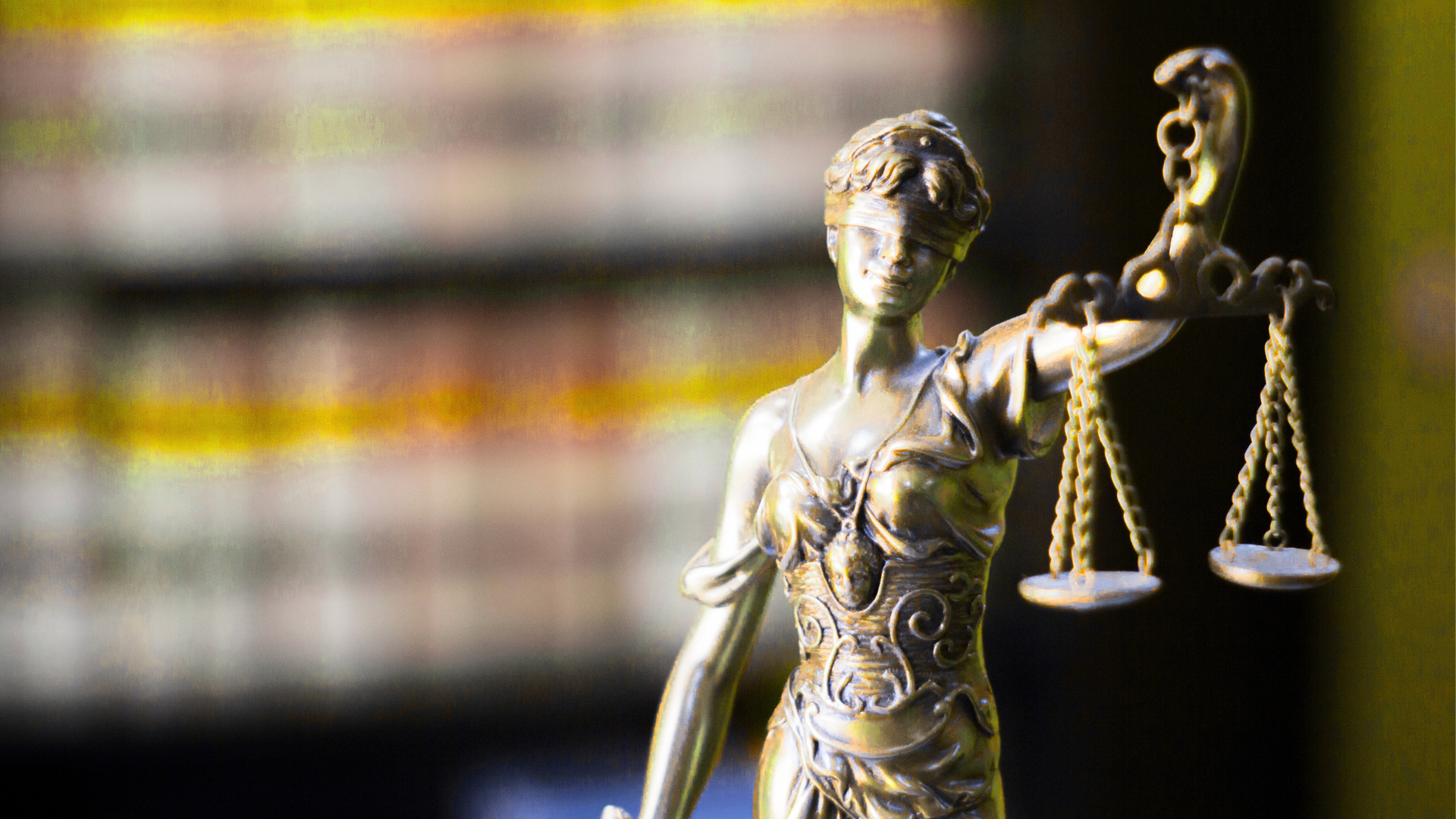 A statue of a woman holding scales of justice in her hands.