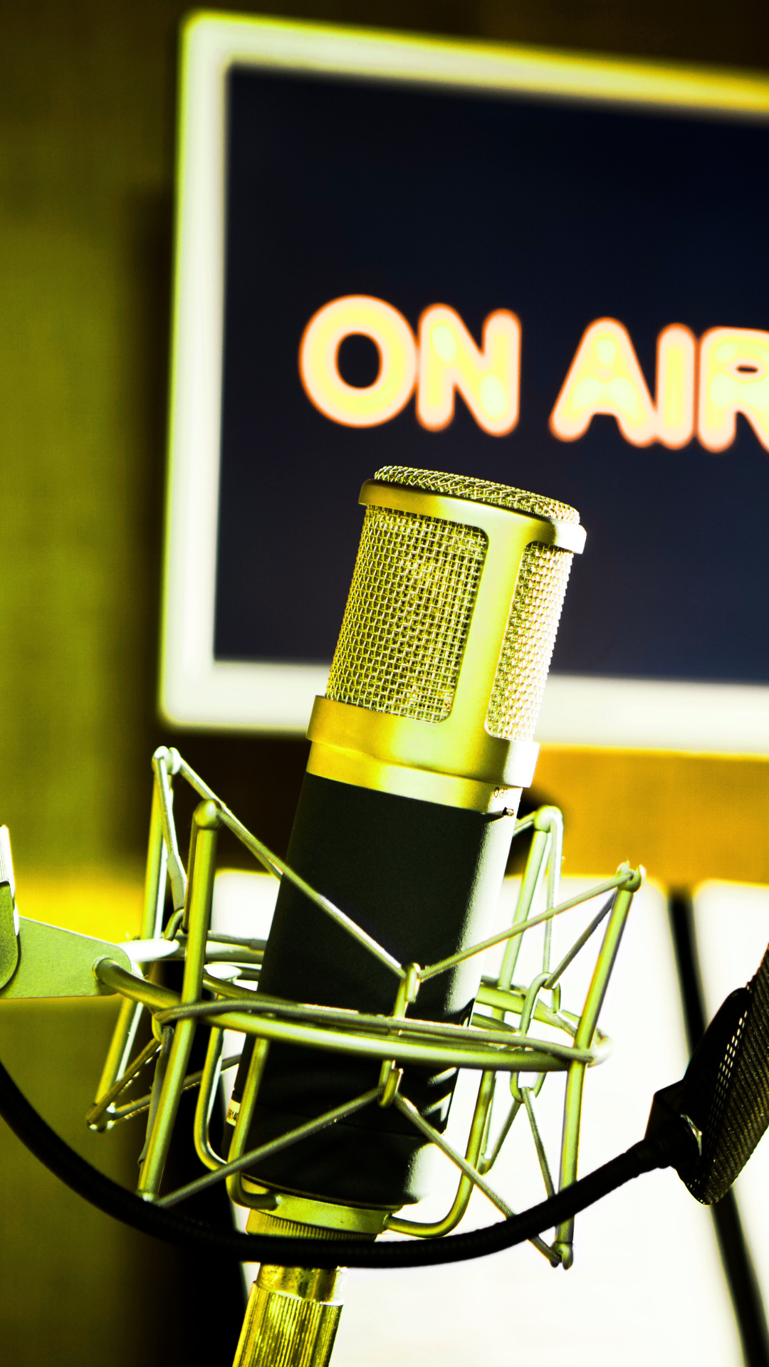 A microphone in front of a sign that says on air