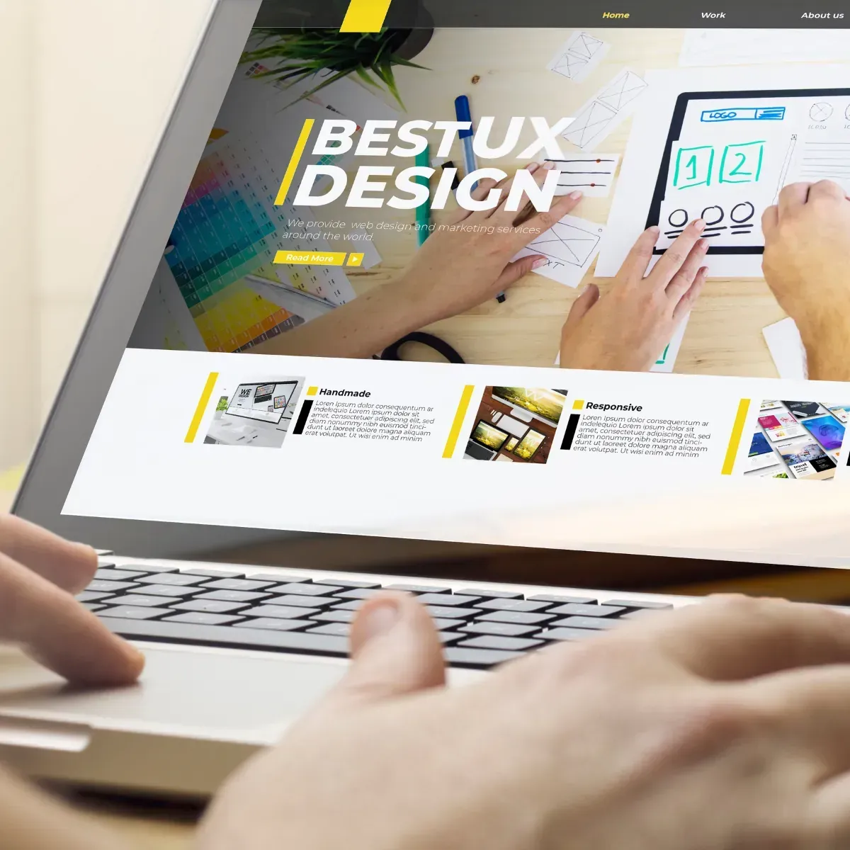 A person is typing on a laptop that says bestux design