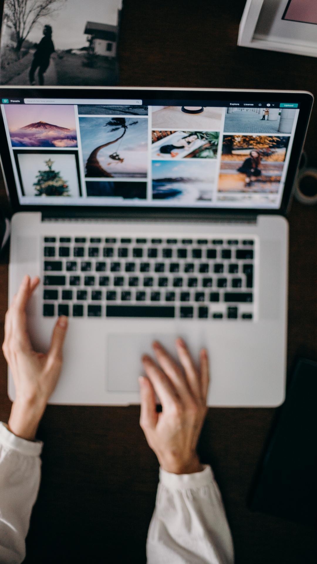 A person is typing on a laptop computer.