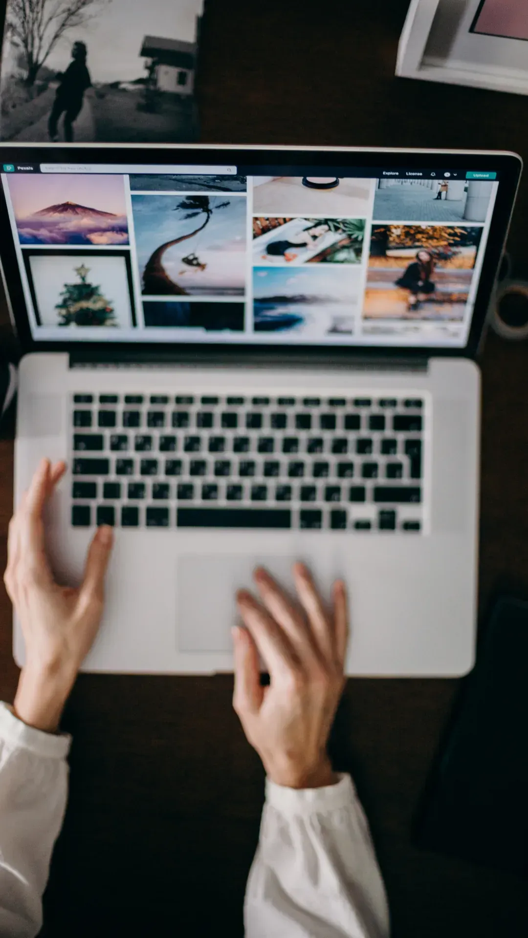 A person is typing on a laptop computer.