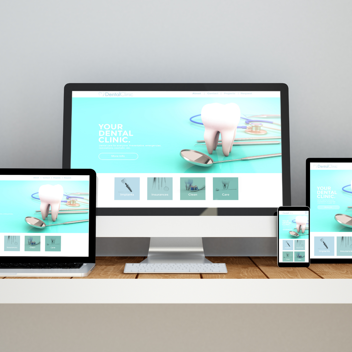 A dental clinic website is displayed on a computer laptop and tablet