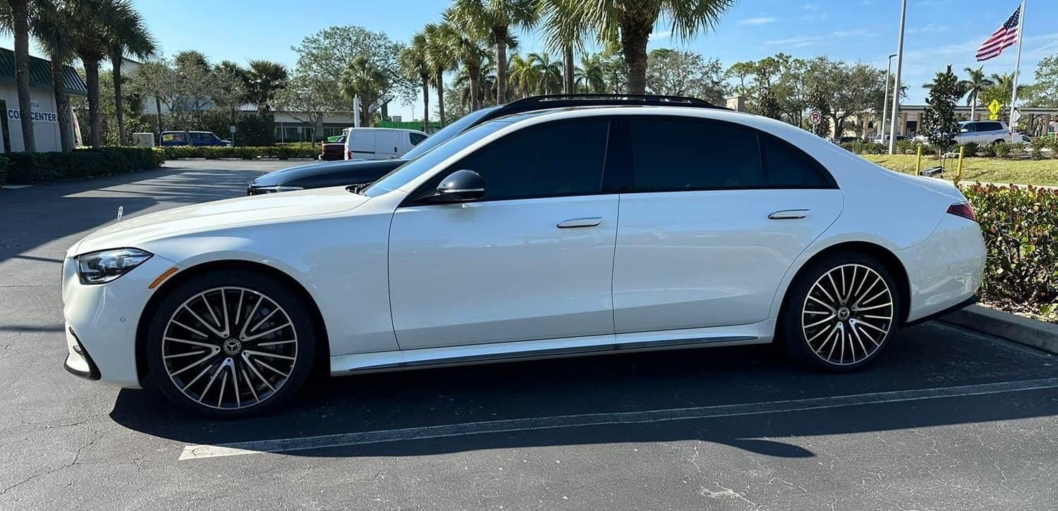 Vehicle windows with dark ceramic tint.