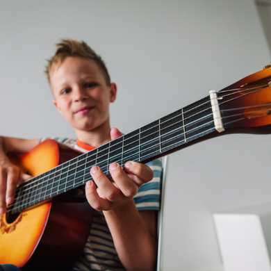 GIRL PLAYING GUITAR