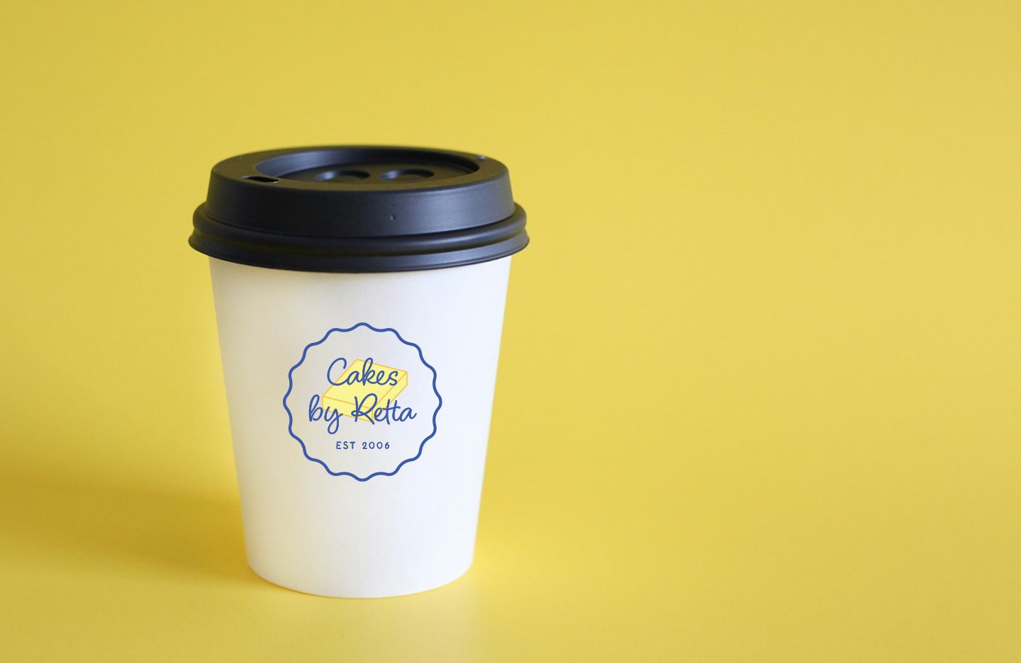 White coffee cup with black lid, 