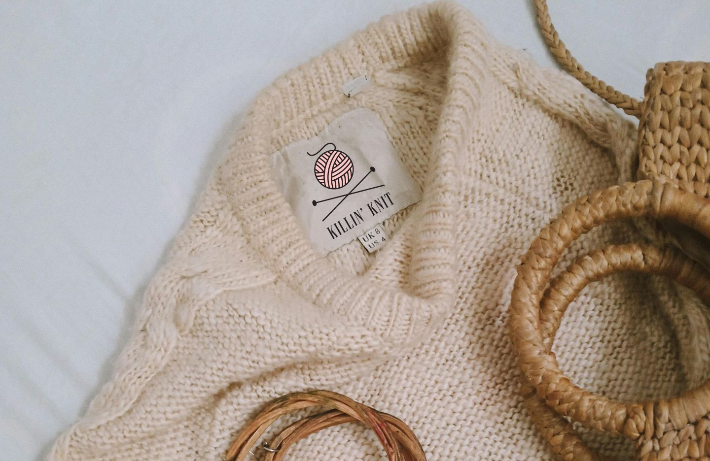 Cream-colored sweater with label
