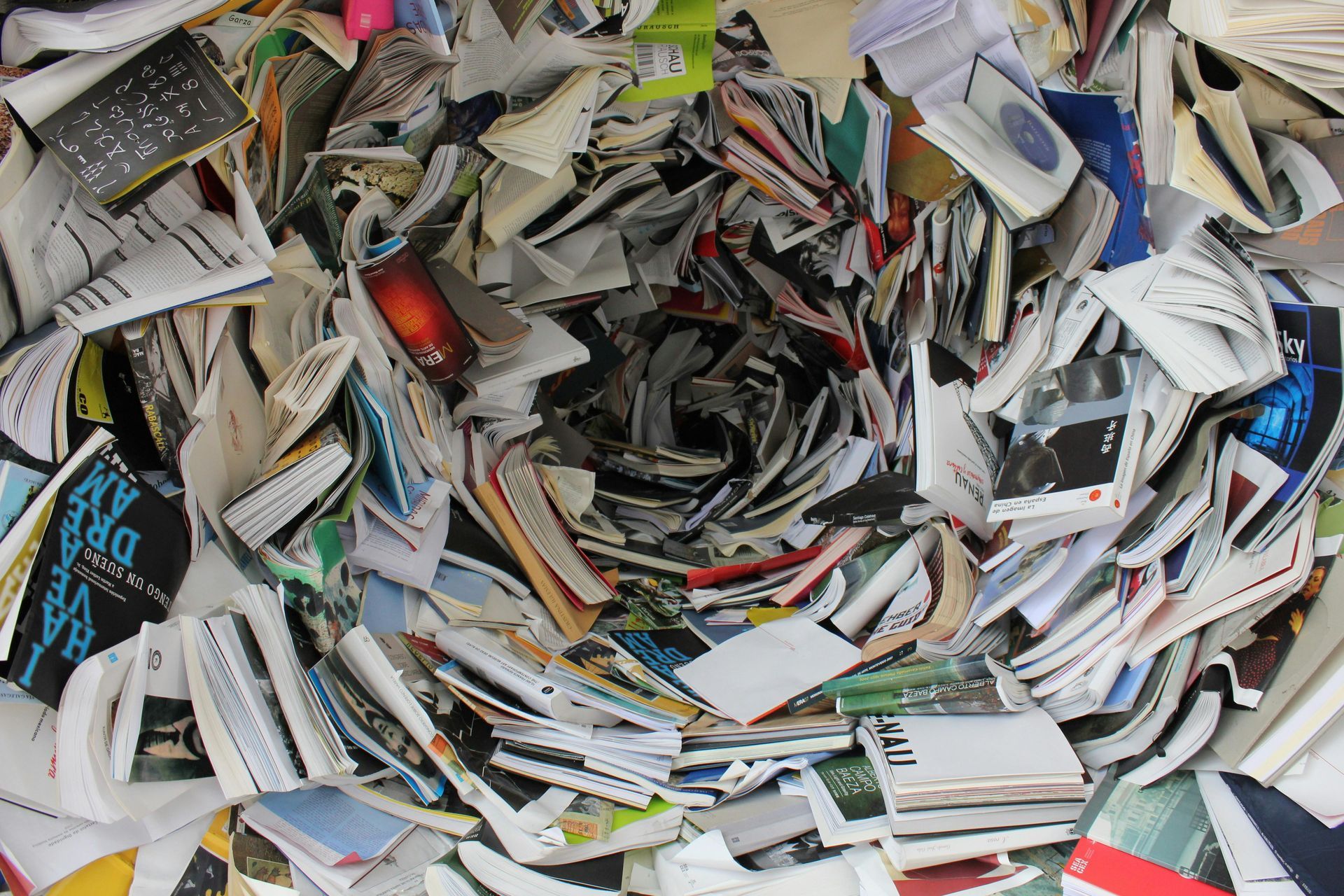 Pile of shredded paper, forming a circular hole at the center.