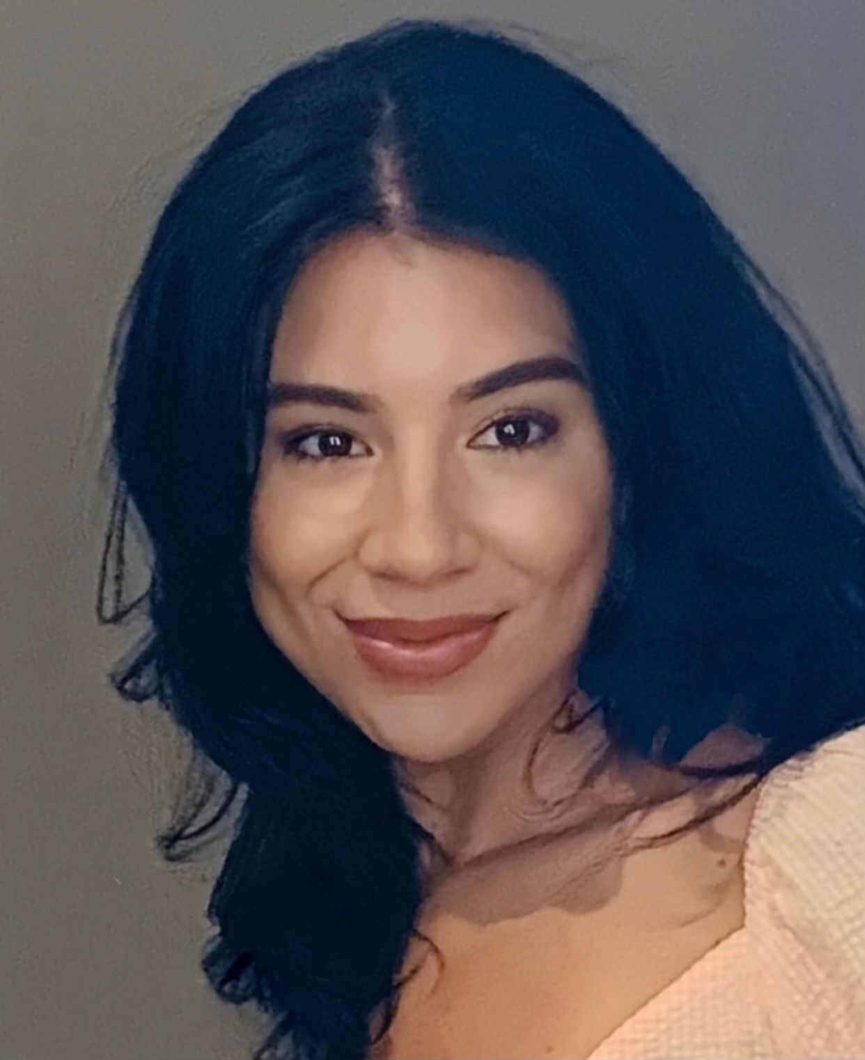 Barbie Concepcion is smiling for the camera.