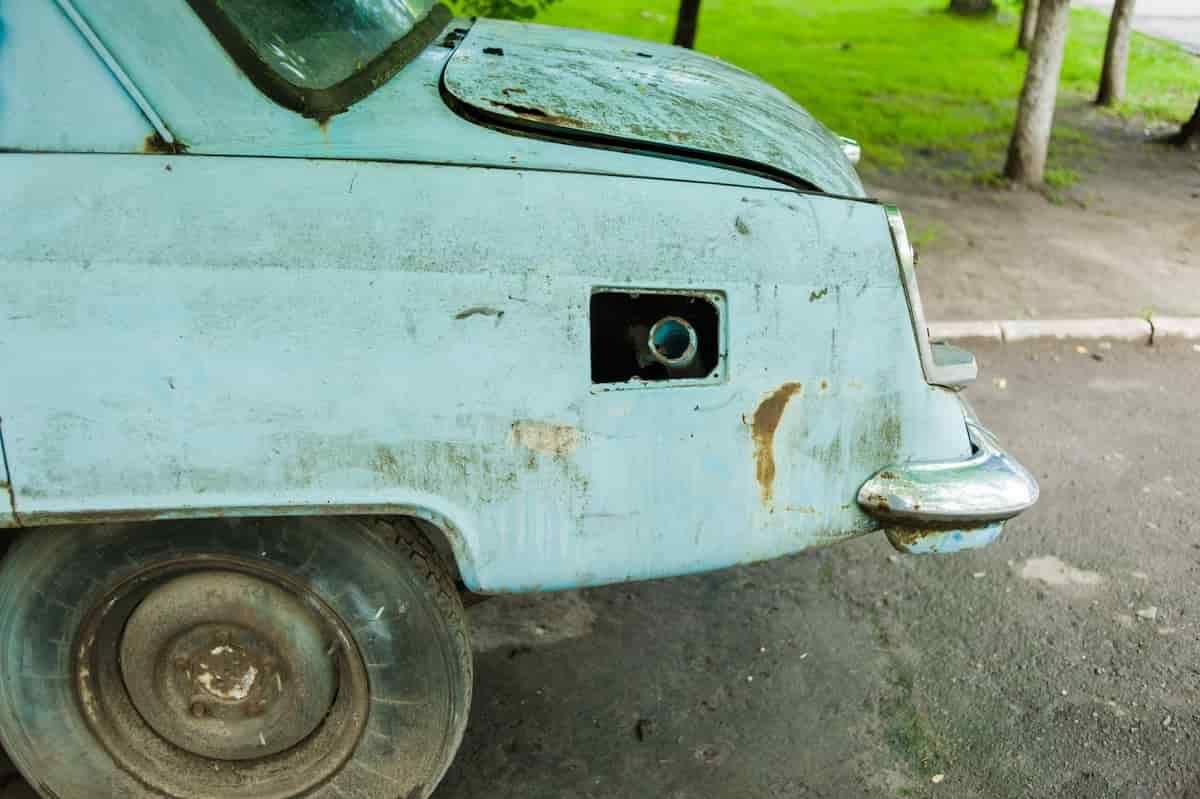 A Close Up Of The Side Of An Old Car With A Broken Fuel Cover — Twin City Auto Dismantlers In Wagga Wagga, NSW