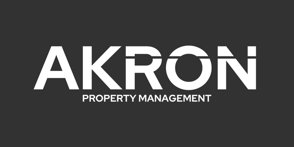 AKRON Property Management logo in white on a dark gray background