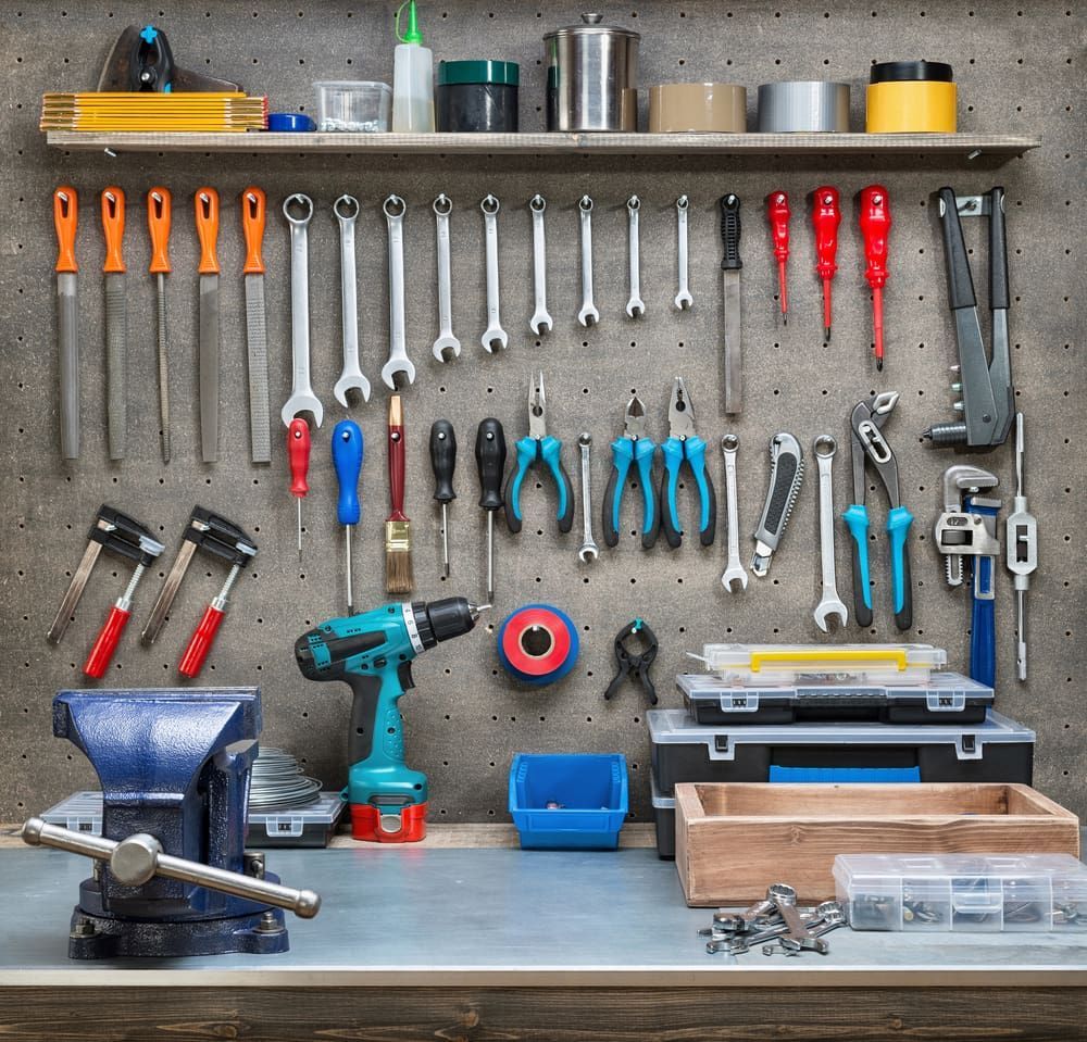 A Workbench With Lots Of Tools Hanging On The Wall — Tenterfield Timber & Hardware in Tenterfield, NSW