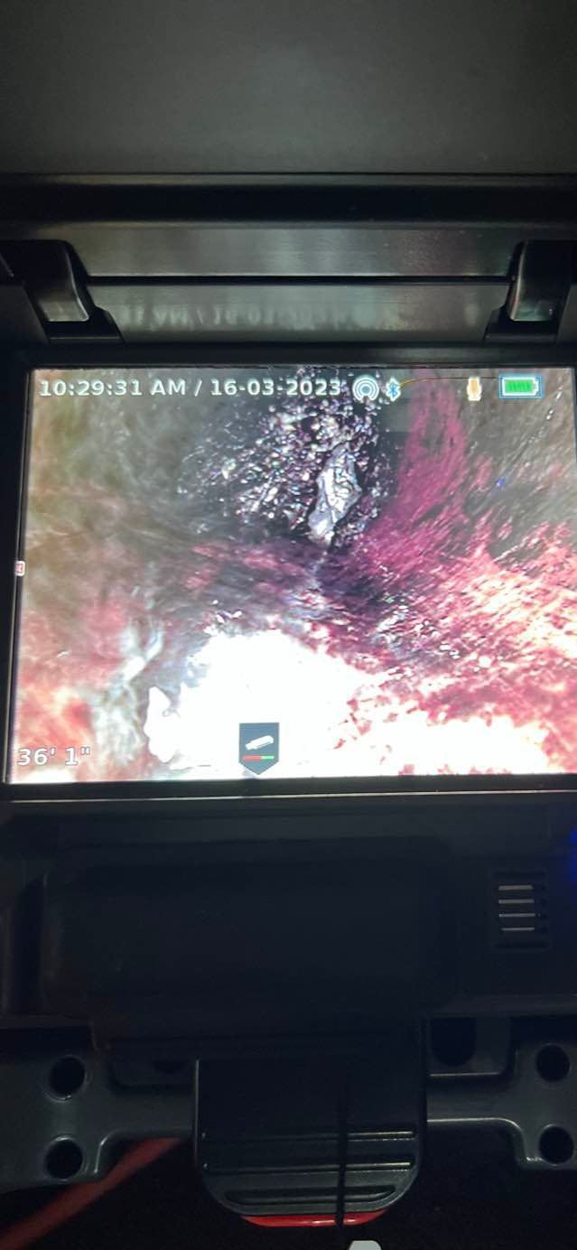 A computer monitor is displaying a picture of a hole in a pipe.
