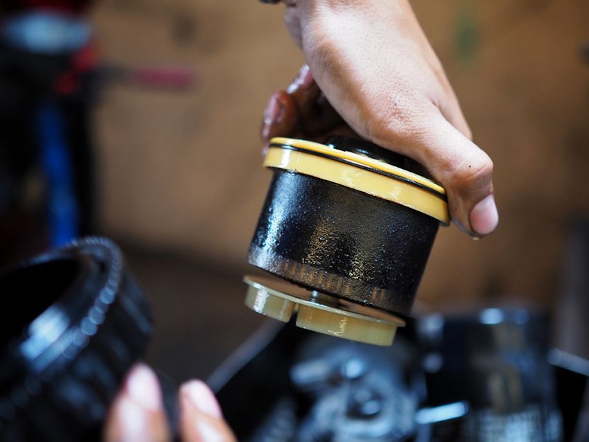 A Person is Holding an Oil Filter — Regen NT in Holtze, NT
