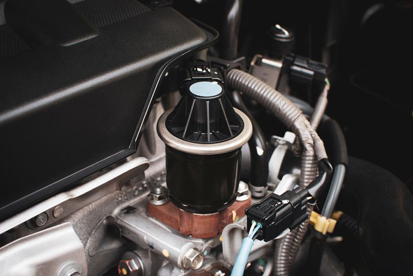 A Close Up of a Car Engine With a Hose Attached to It — Regen NT in Holtze, NT